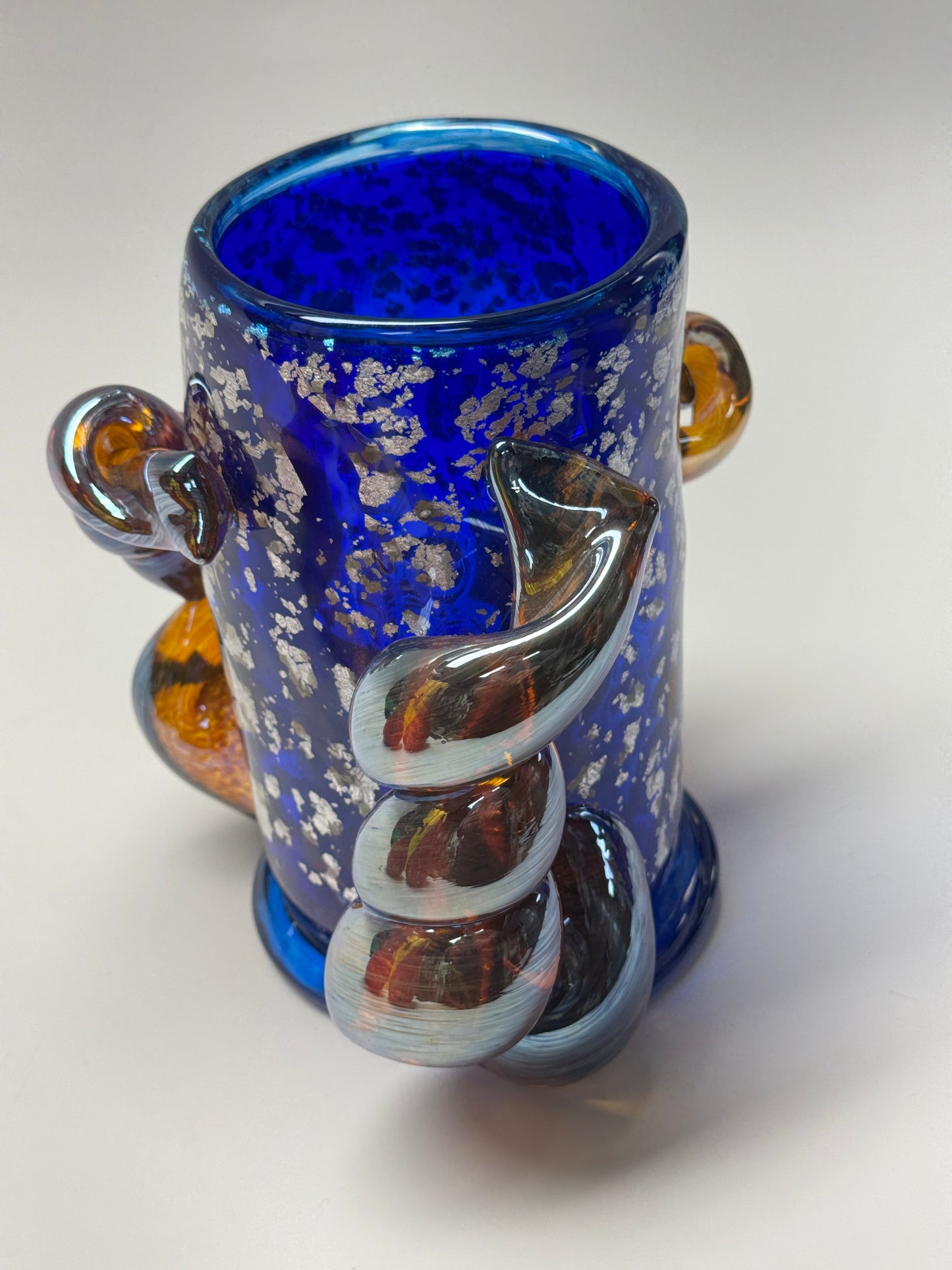 Blue, silver, and amber handblown glass vase