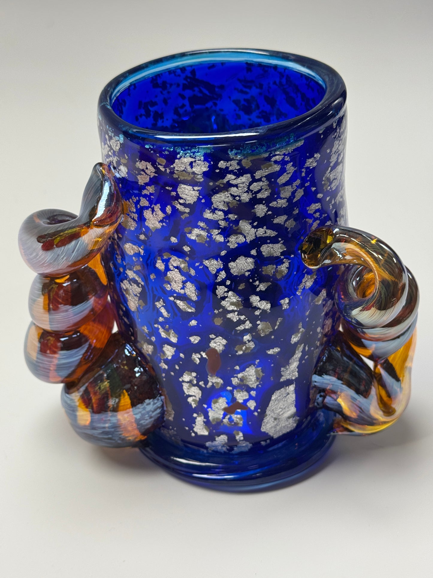 Blue, silver, and amber handblown glass vase