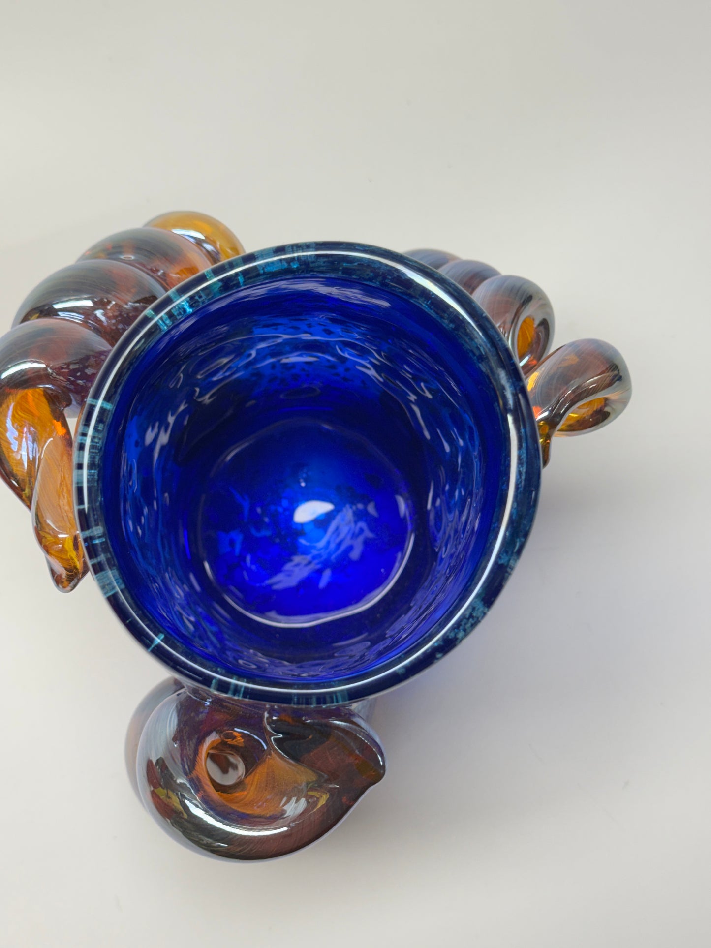 Blue, silver, and amber handblown glass vase
