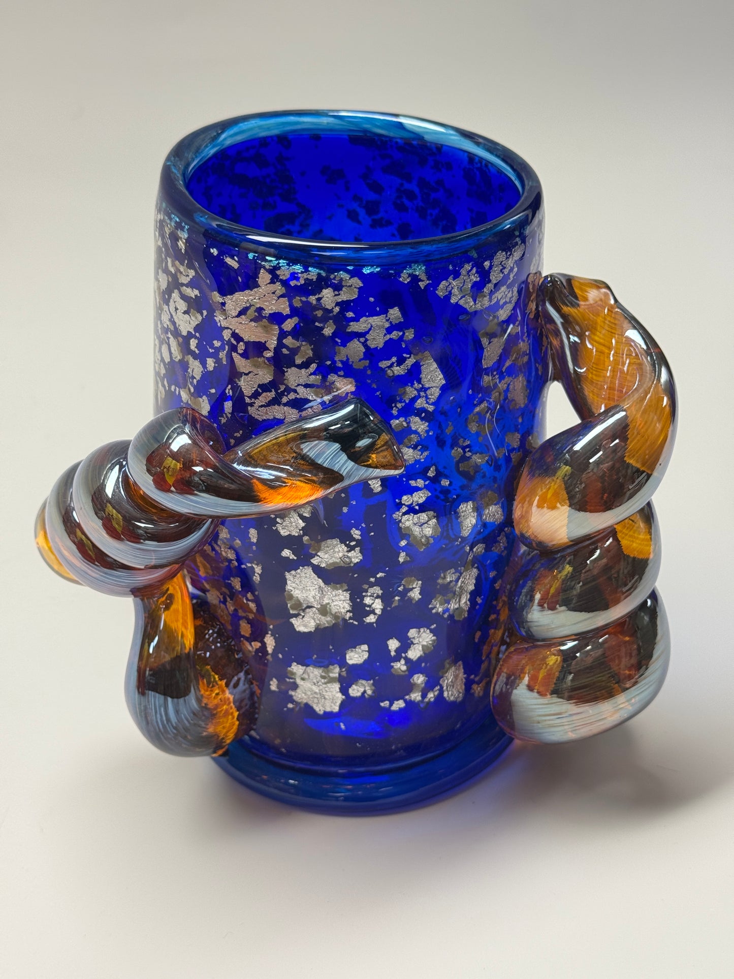 Blue, silver, and amber handblown glass vase