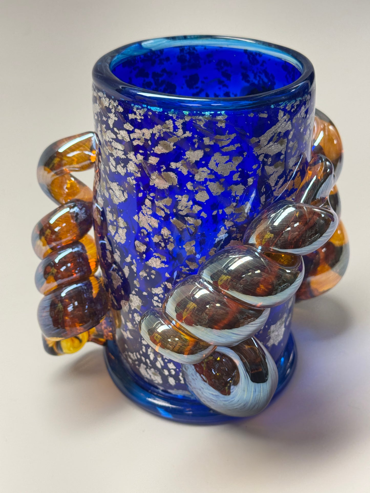 Blue, silver, and amber handblown glass vase