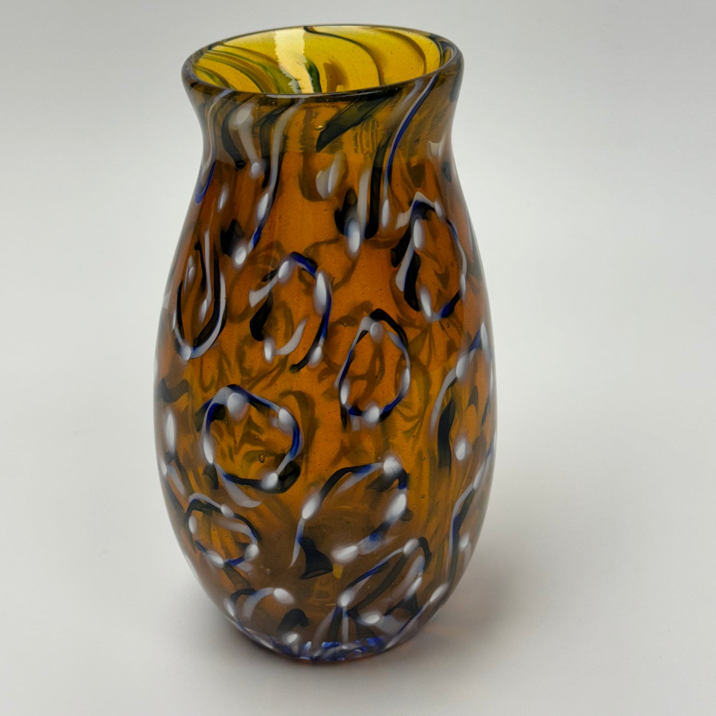 Blue-white spiral on amber vase