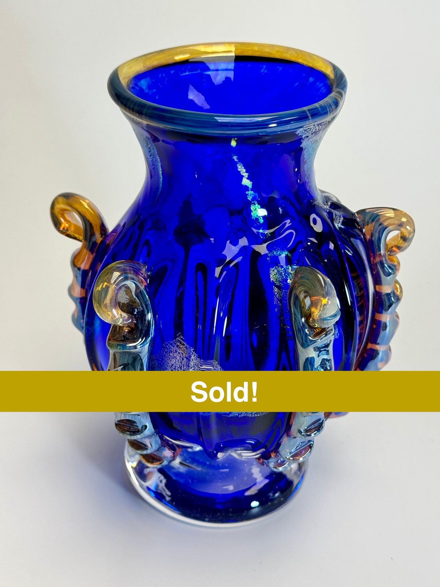 Handblown blue, gold, and dichroic glass vase