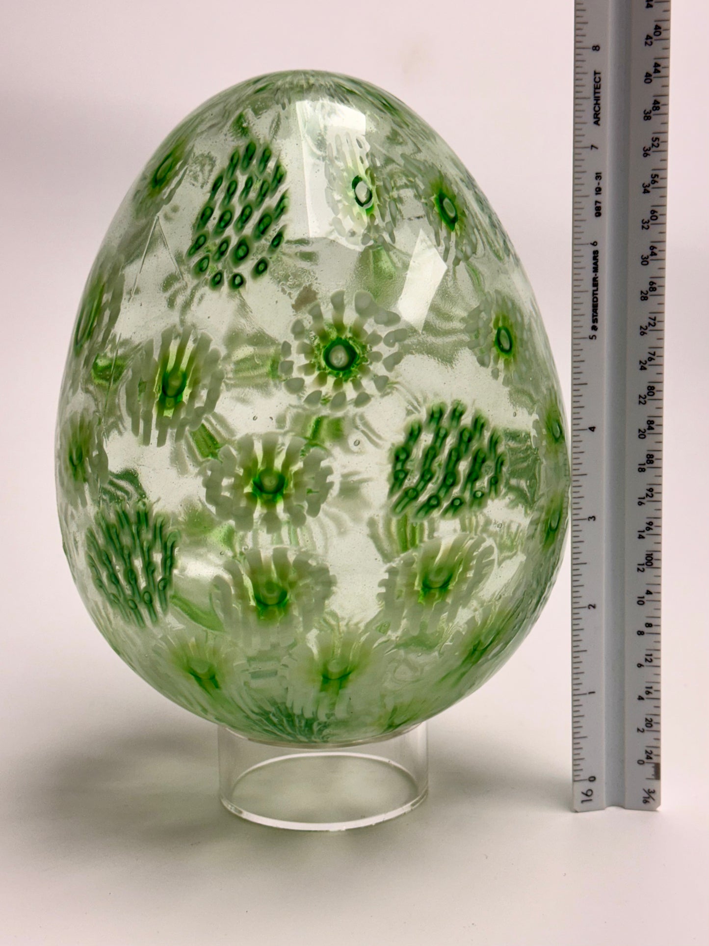 Green, white, and clear “jeweled" seven-inch egg. Handblown murrine glass art.