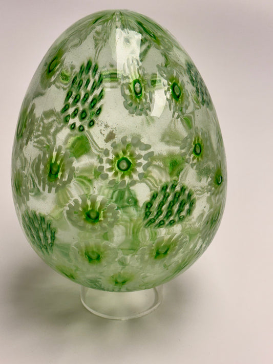 Green, white, and clear “jeweled" seven-inch egg. Handblown murrine glass art.