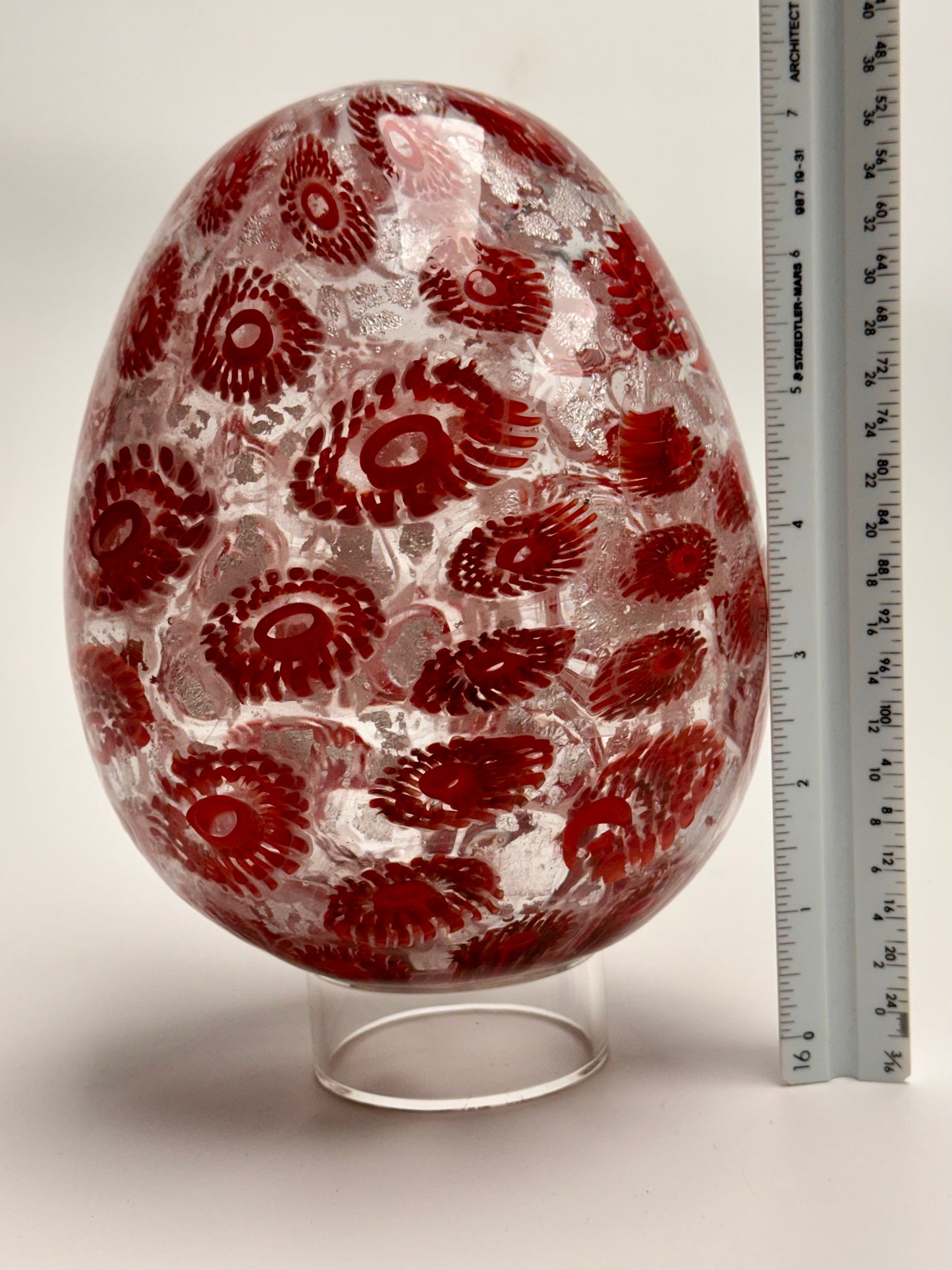 Red and silver “jeweled" seven-inch egg. Handblown murrine glass art.
