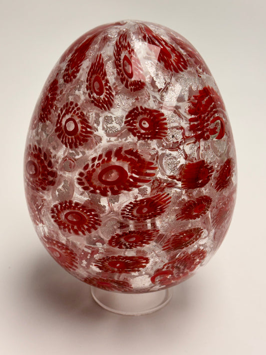 Red and silver “jeweled" seven-inch egg. Handblown murrine glass art.