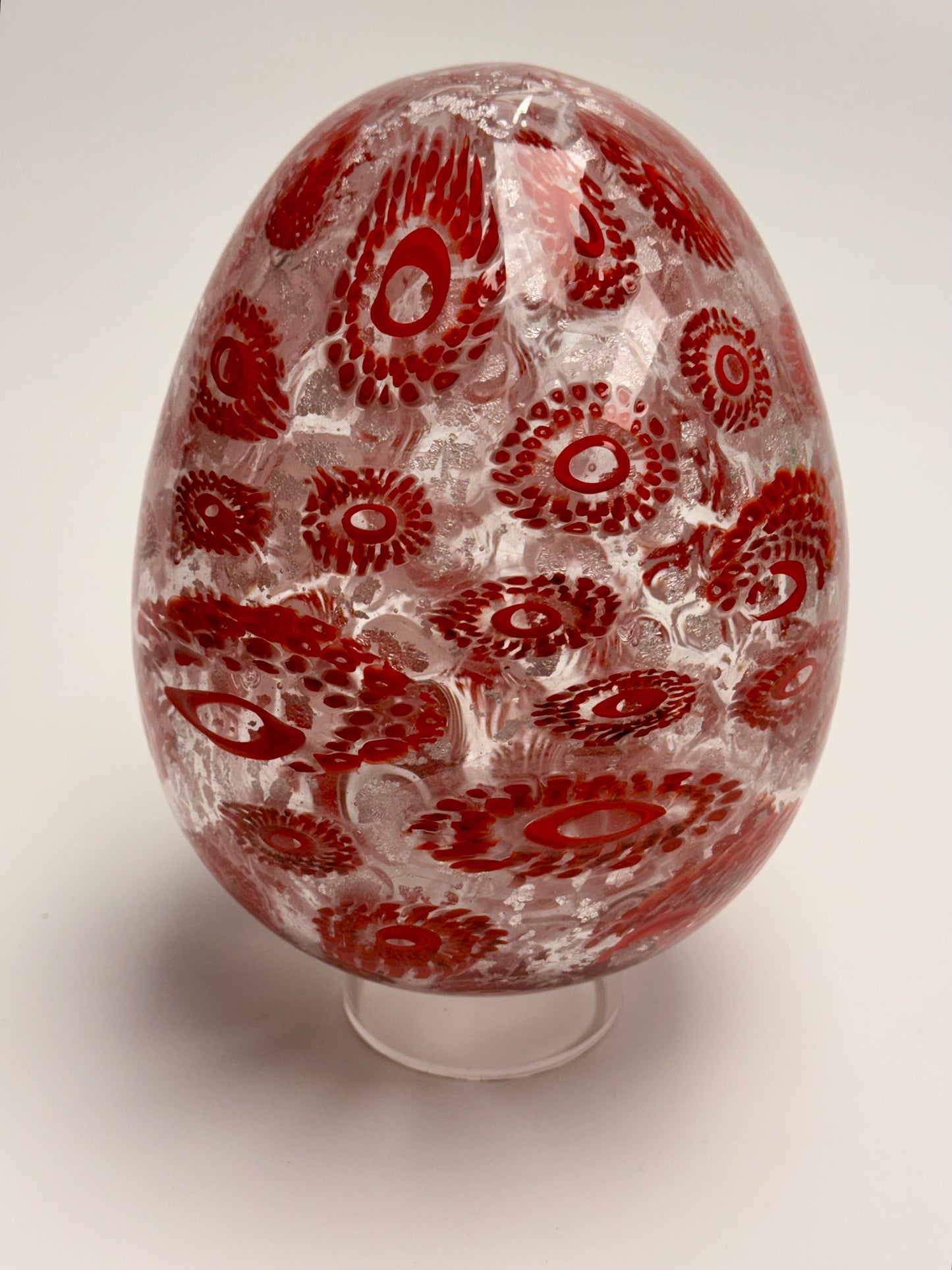 Red and silver “jeweled" seven-inch egg. Handblown murrine glass art.