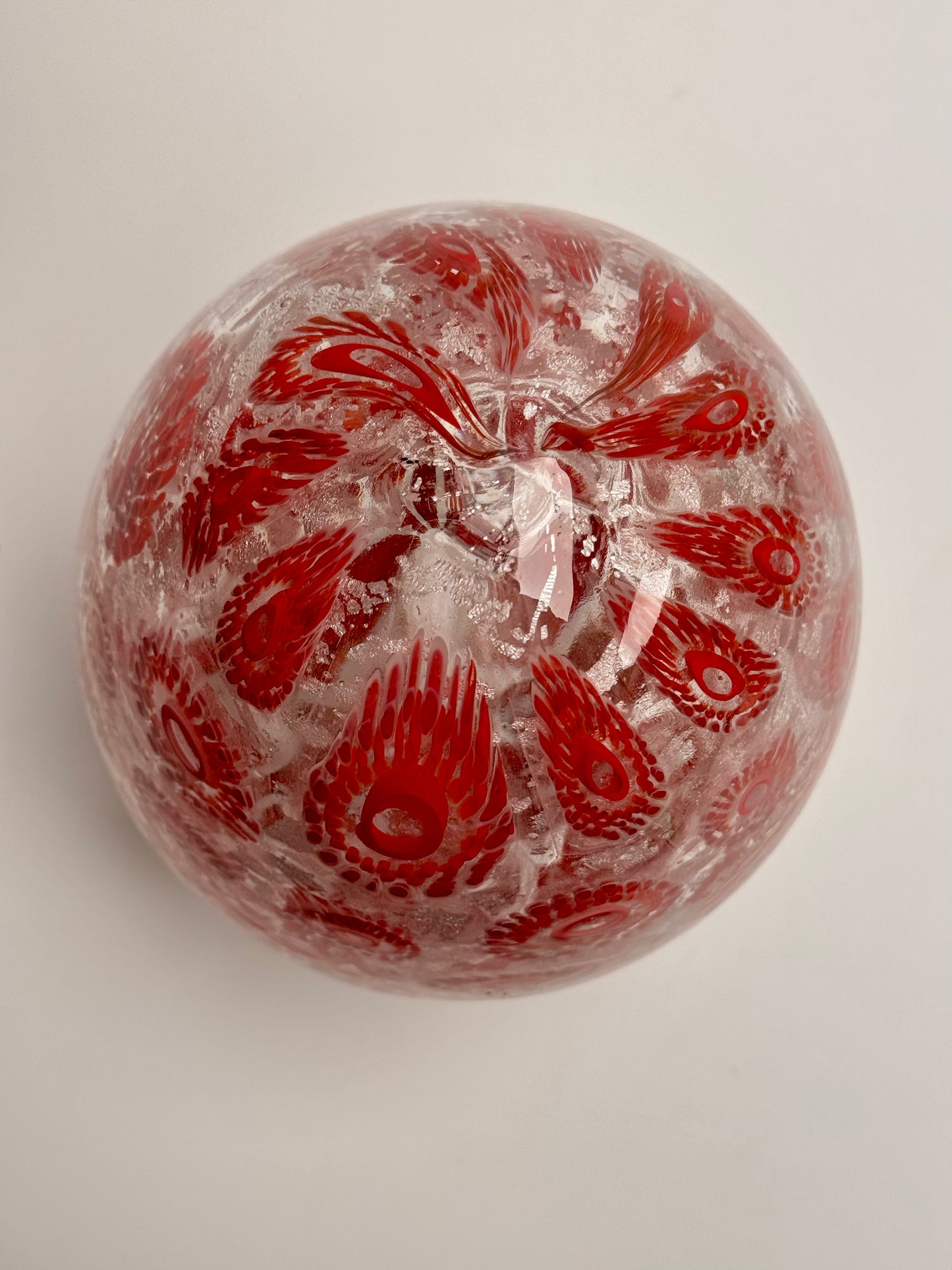 Red and silver “jeweled" seven-inch egg. Handblown murrine glass art.