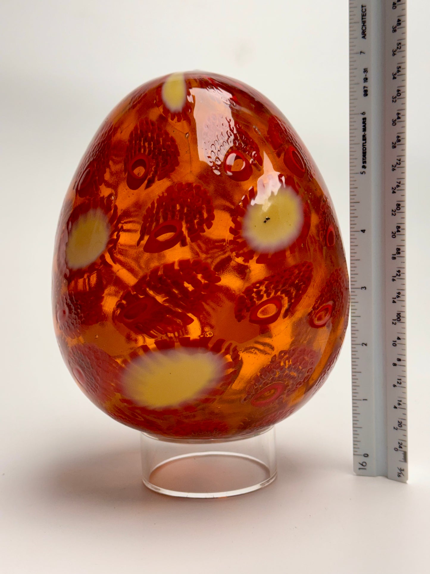 Red, cream and gold “jeweled" six-inch egg. Handblown murrine glass art.