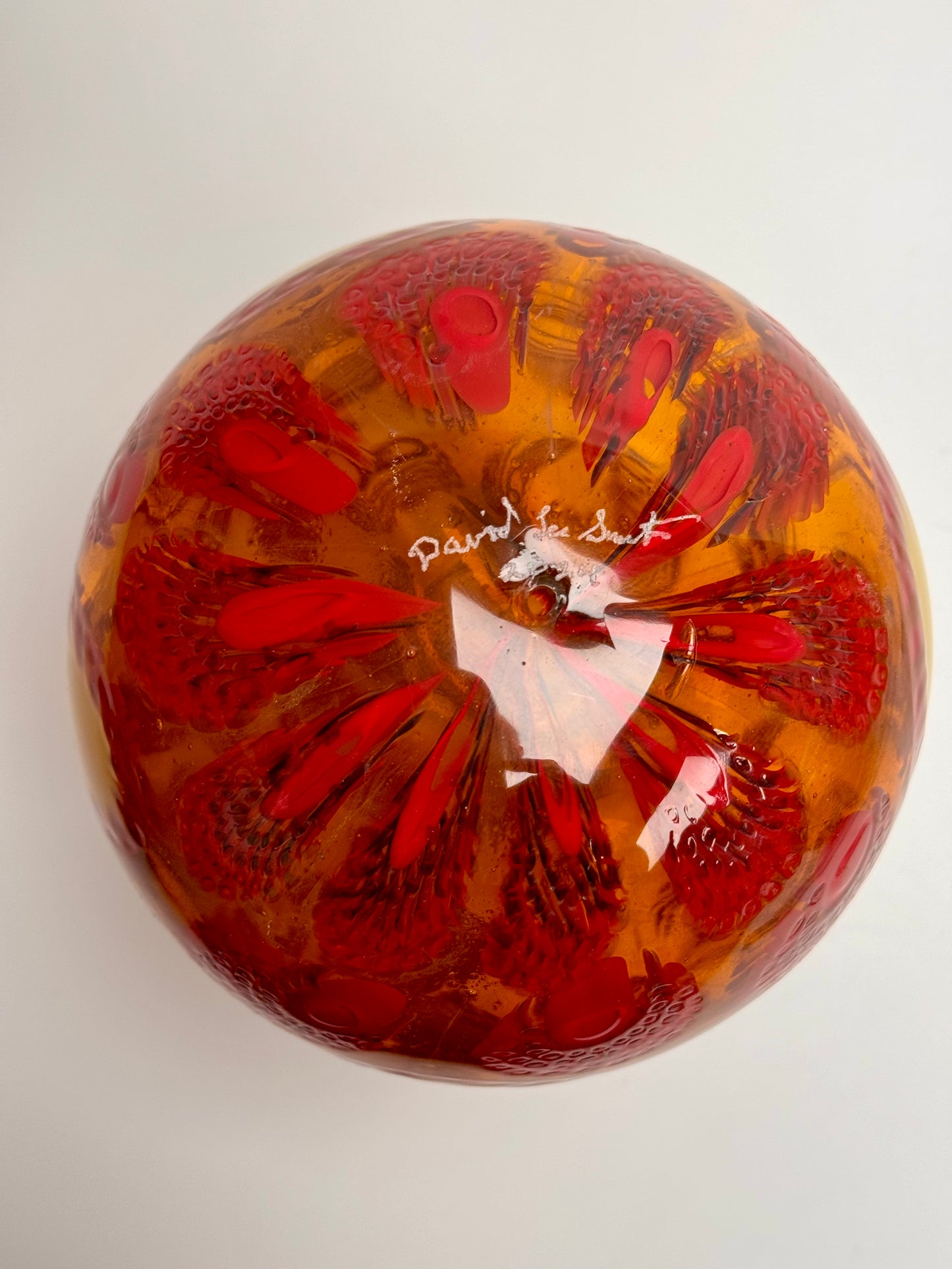 Red, cream and gold “jeweled" six-inch egg. Handblown murrine glass art.
